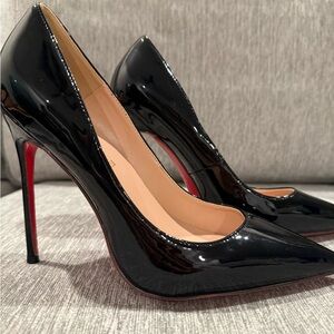 Red bottom black patent heels